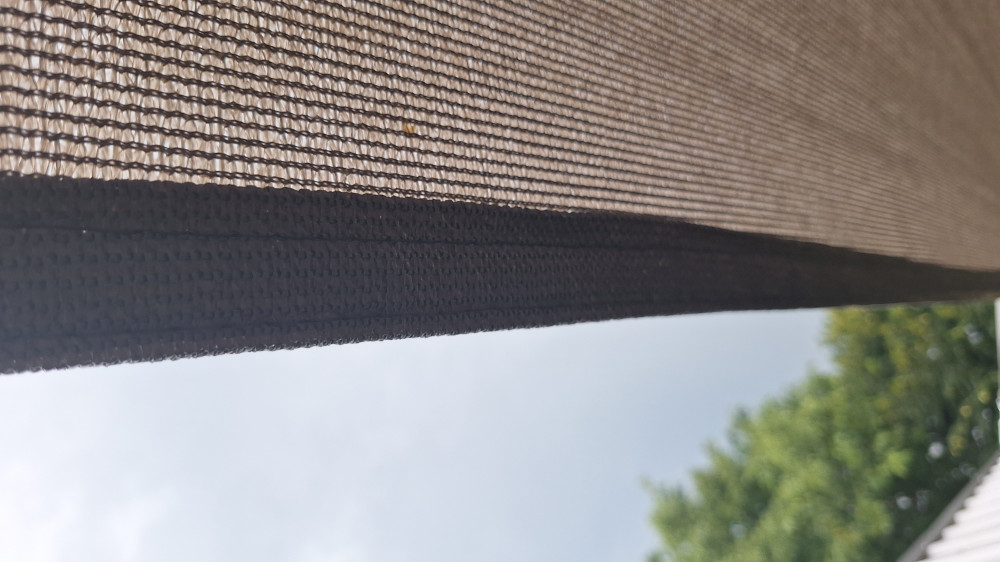 Napvitorla - árnyékoló teraszra, háromszög alakú 5x5x5 m Fehér színben - HDPE anyagból Napvitorla - árnyékoló teraszra, háromszög alakú 5x5x5 m Fehér színben - HDPE anyagból